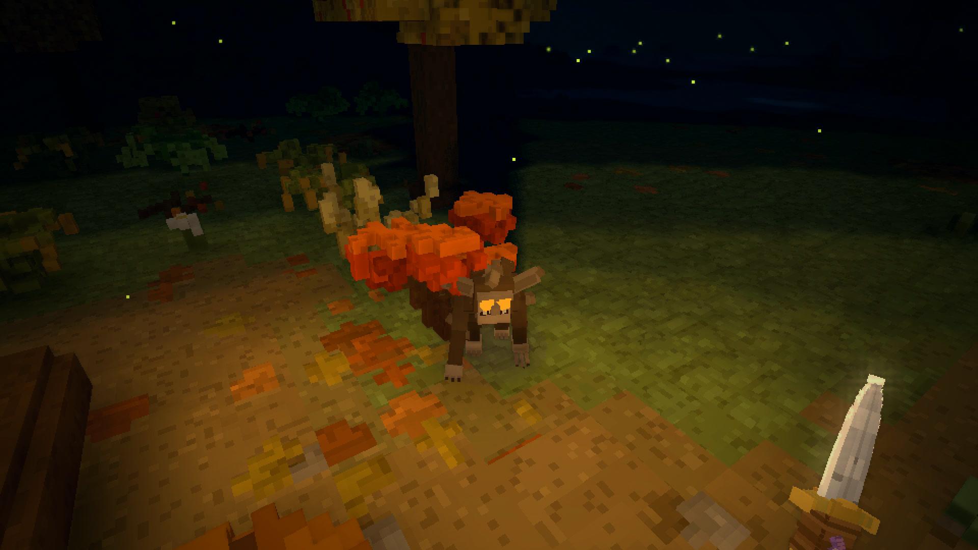 First person at night: the blade in the wanderer's own hand and the firelight on the ground ahead